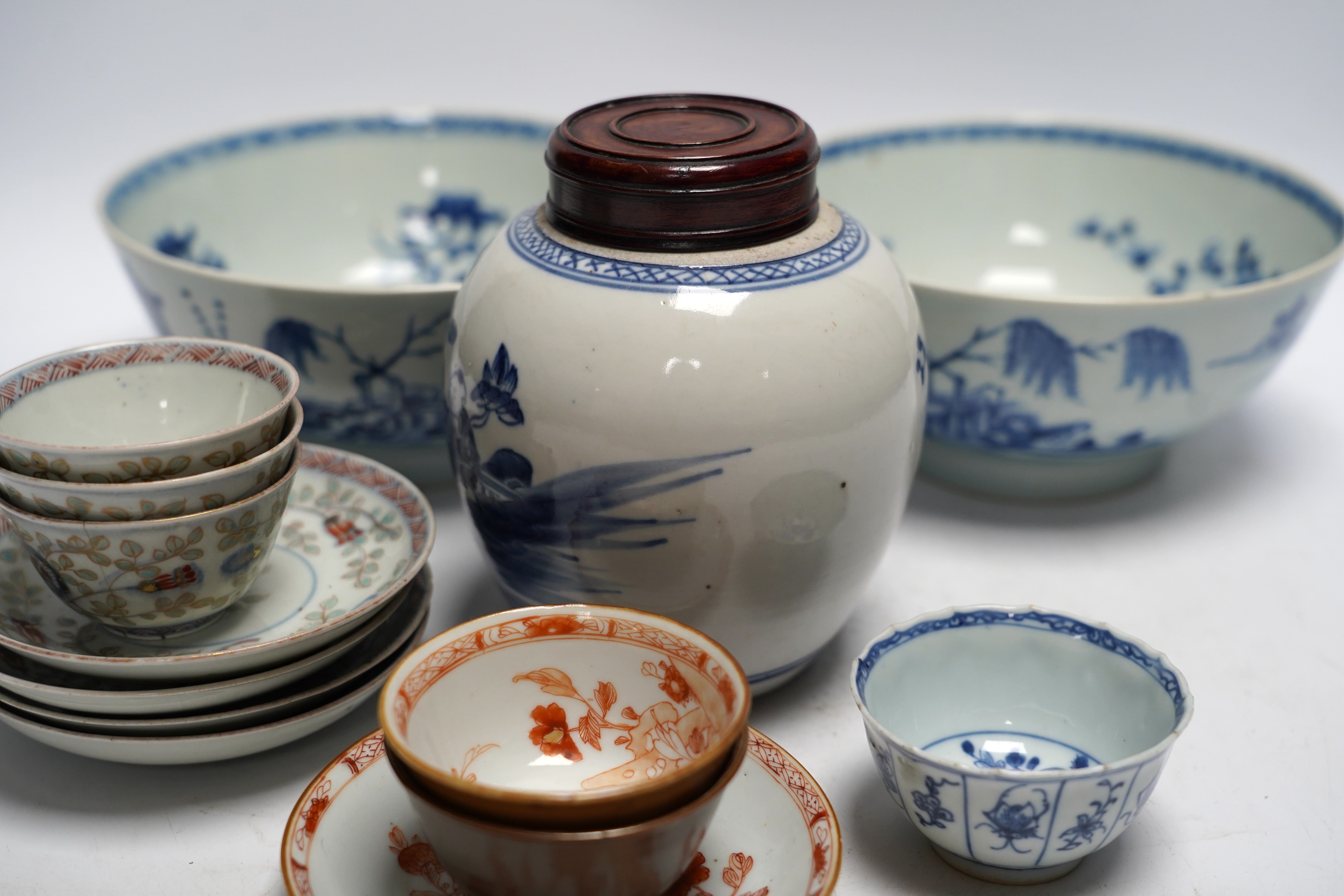 A group of 18th century Chinese and Japanese porcelain including blue and white bowls and jar with hardwood cover, largest 19cm in diameter